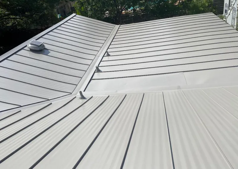 Solar attic fan installed on a metal roof for Roof Ventilation in Gatesville
